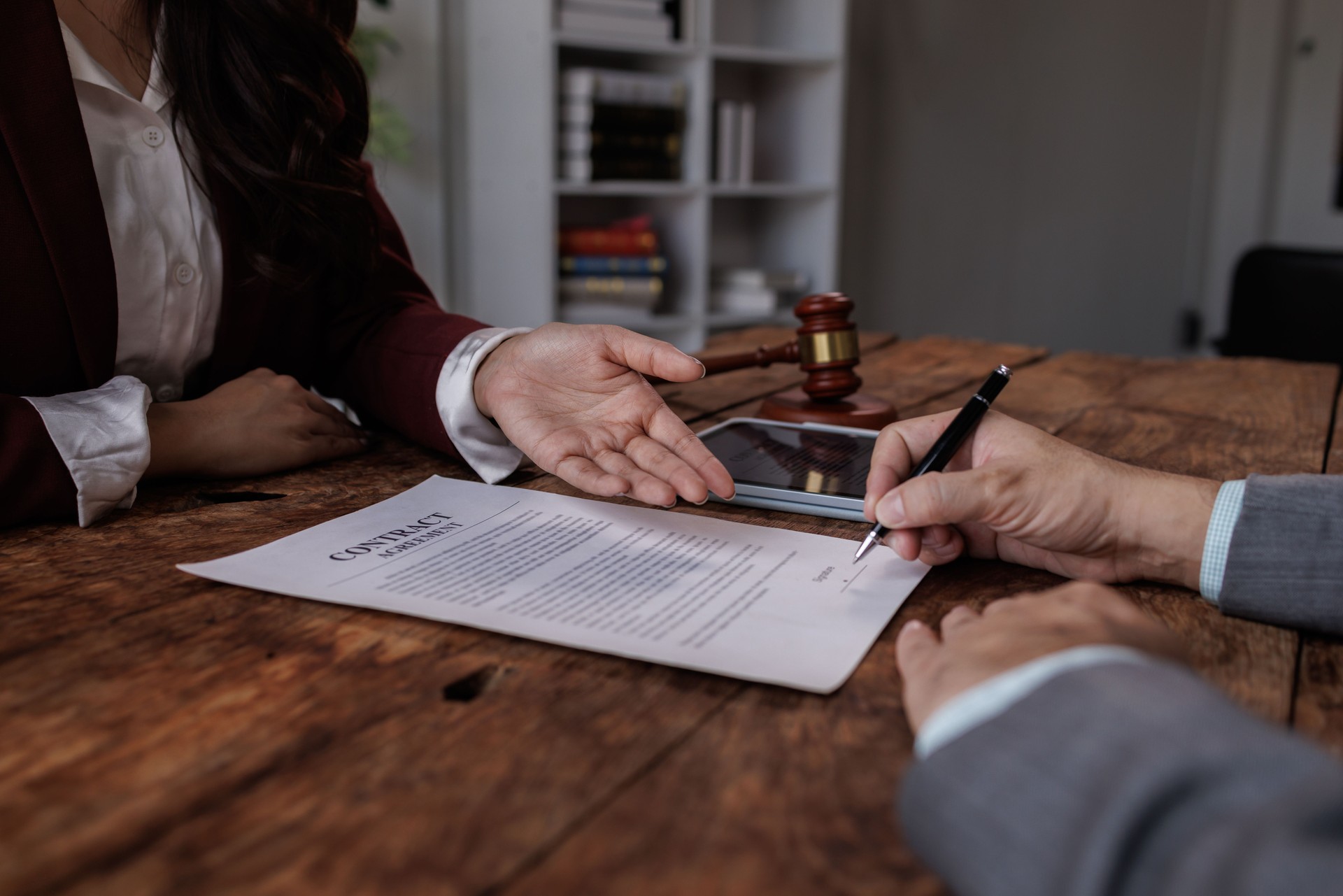 Notary with client in office,Judge gavel with Justice lawyers 
lawyer or judge counselor having team meeting with client, Law and Legal services concept.